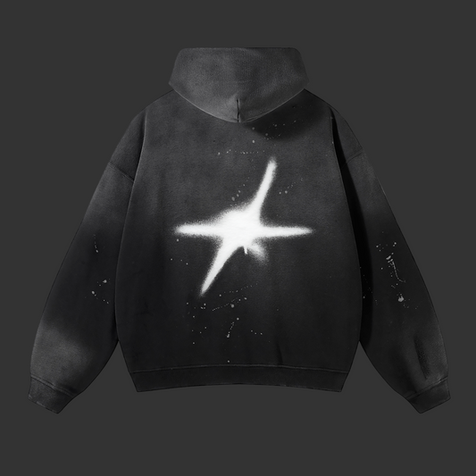 Black hoodie with a star design on the back against a white background